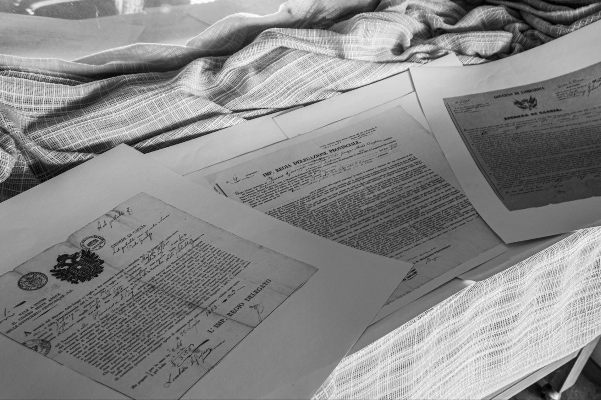 Archival civil documents laid out on a table